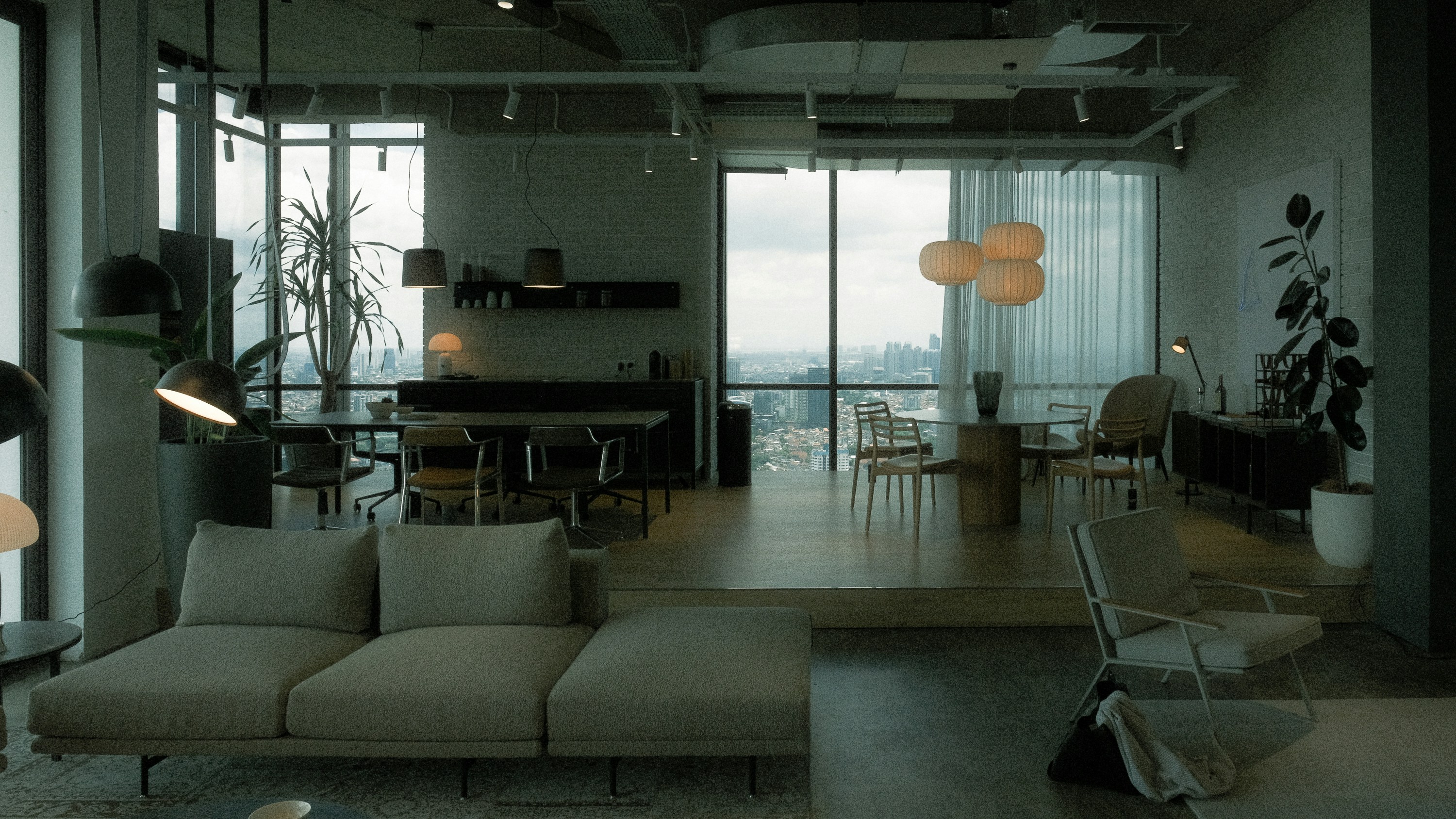 coworking lounge with modern furniture and city views - best apartment community amenities