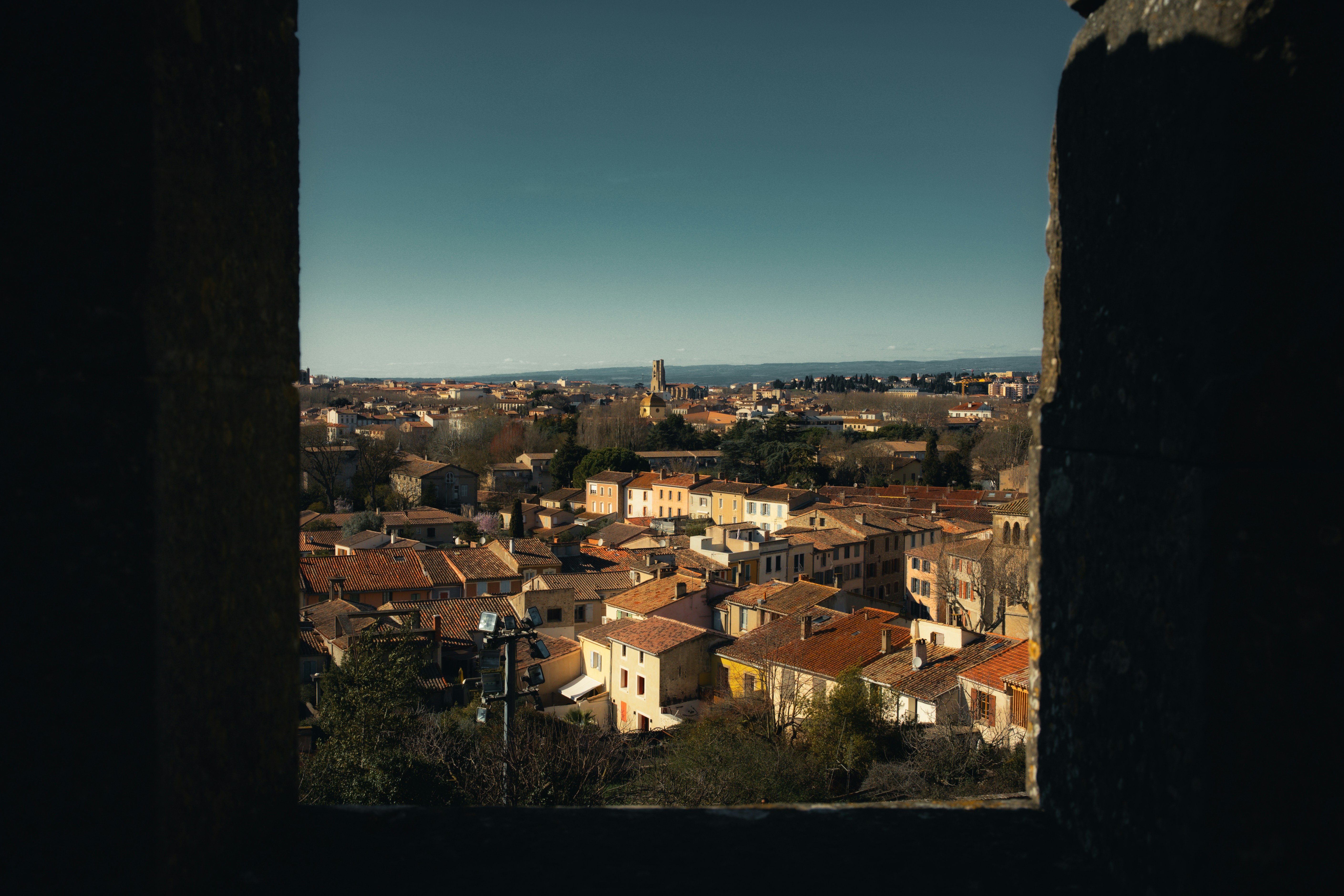 Cityscape view from a window on a sunny day.