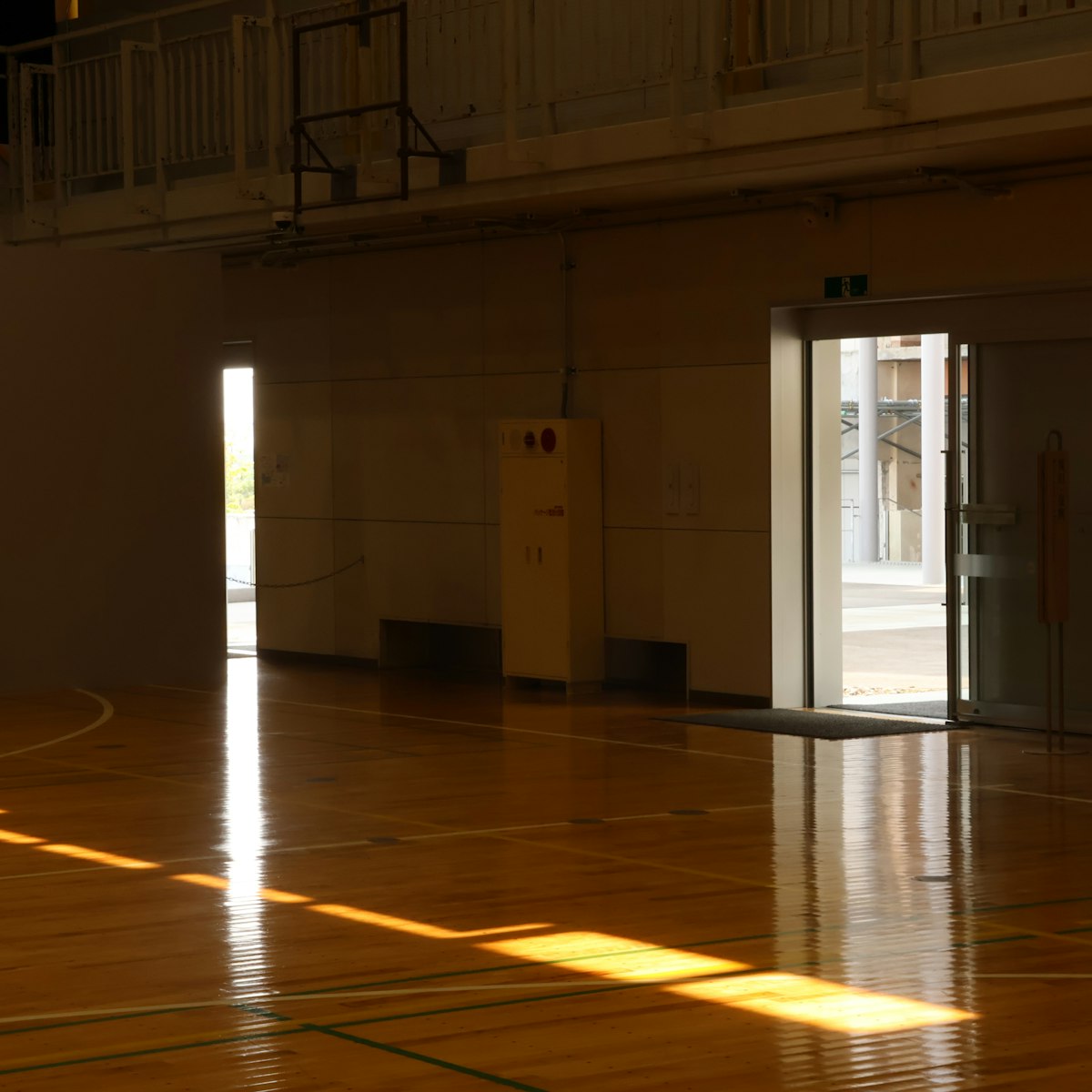 Sunlight across the Community Center multipurpose floor.