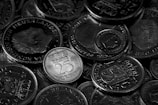Pile of dutch coins in monochrome view.