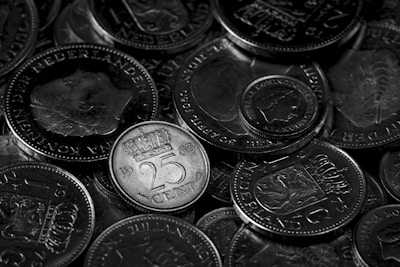 Pile of dutch coins in monochrome view.