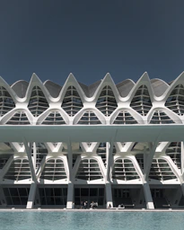 Modern architecture and a striking turquoise pool.