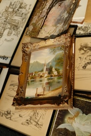 Artwork, including a framed painting, is displayed.