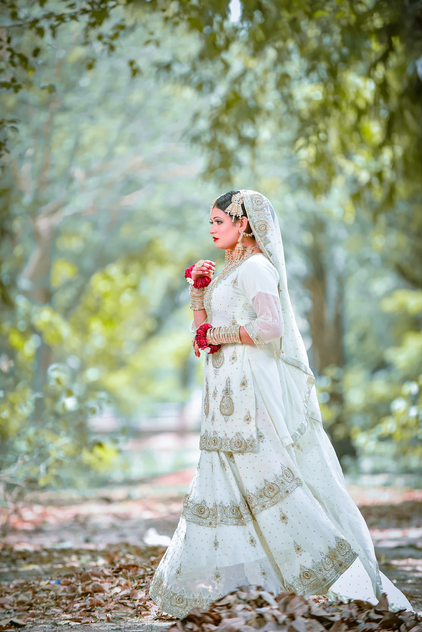Questions to ask your wedding photographer before booking — A photographer captures a bride in natural light
