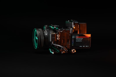A futuristic camera with glowing neon accents.