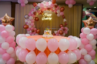 A festive birthday celebration decorated with balloons.