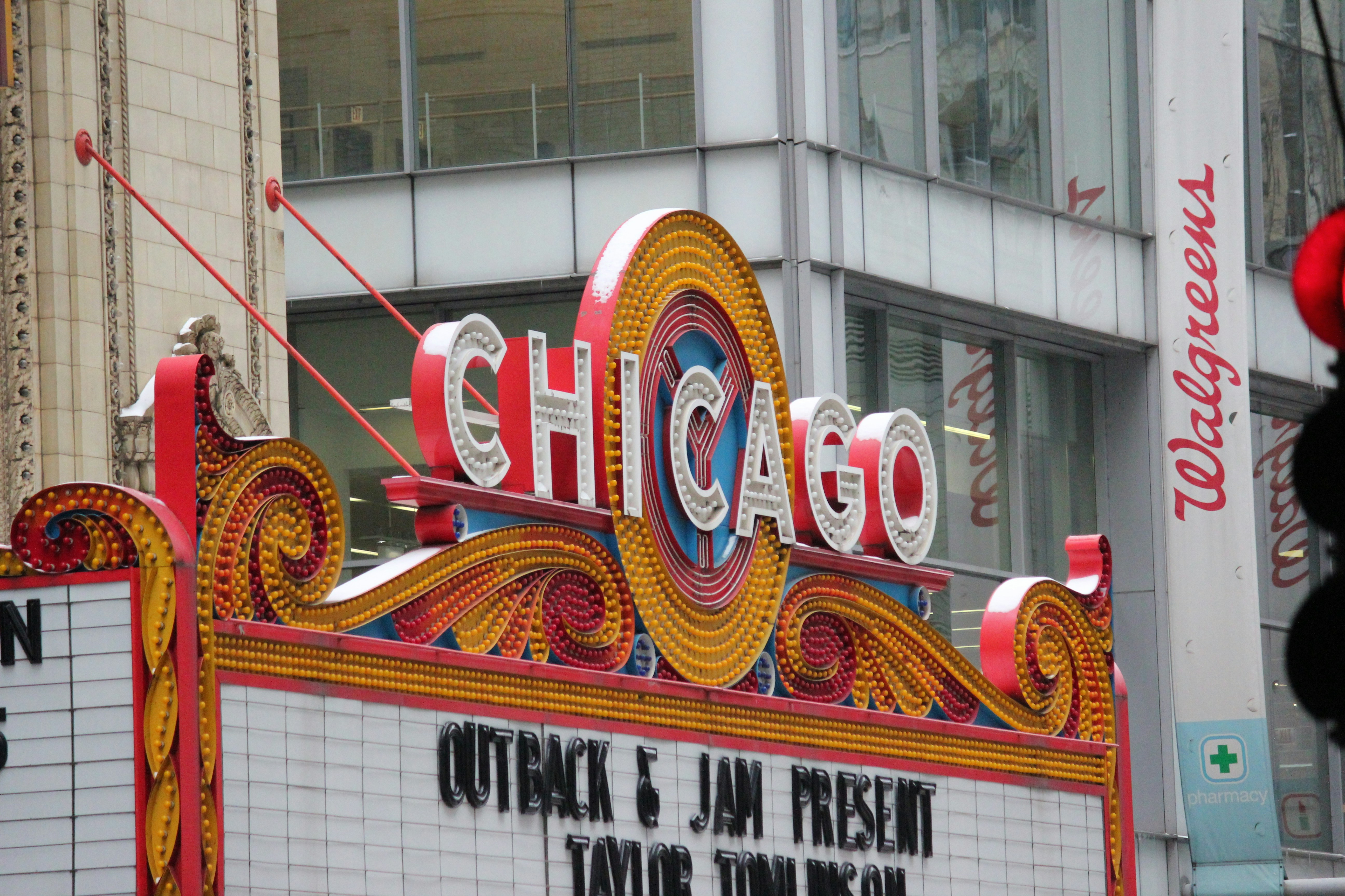 a vibrant Chicago neighborhood street scene like the Uptown Theatre - studio apartments chicago
