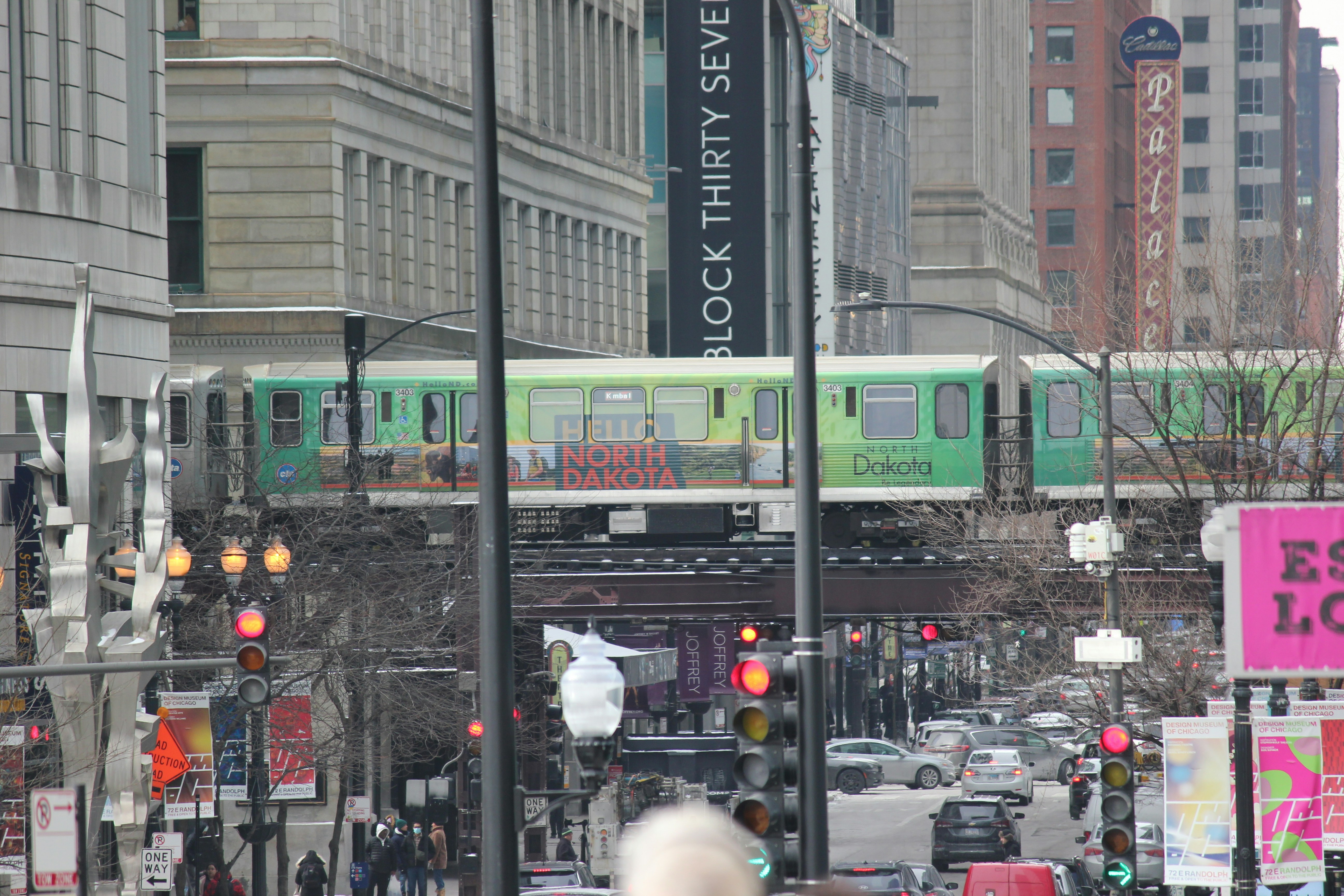 the CTA 'L' train passing over a crowded street - street festivals chicago