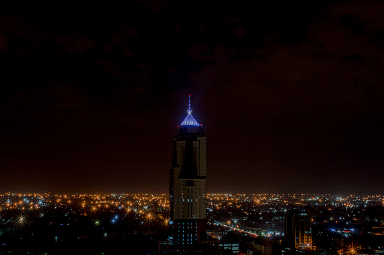 A Nairobi tower lit above the city at night