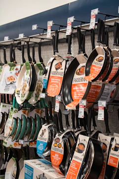 Pans from farberware are displayed at the store.