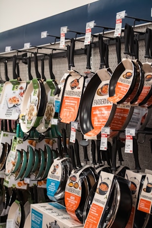 Pans from farberware are displayed at the store.