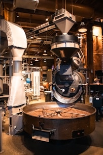 Coffee beans roasting in an industrial machine.