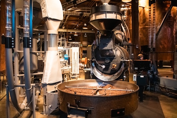 Coffee beans roasting in an industrial machine.