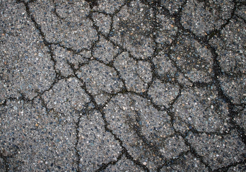 sinkhole, collapsed road, damaged pavement, sewer pipe, urban infrastructure