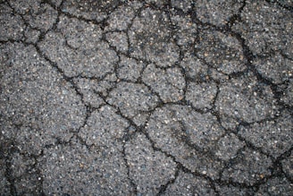 Cracked asphalt covers the entire surface.