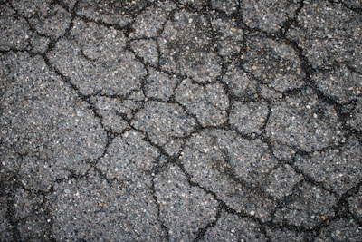Cracked asphalt covers the entire surface.