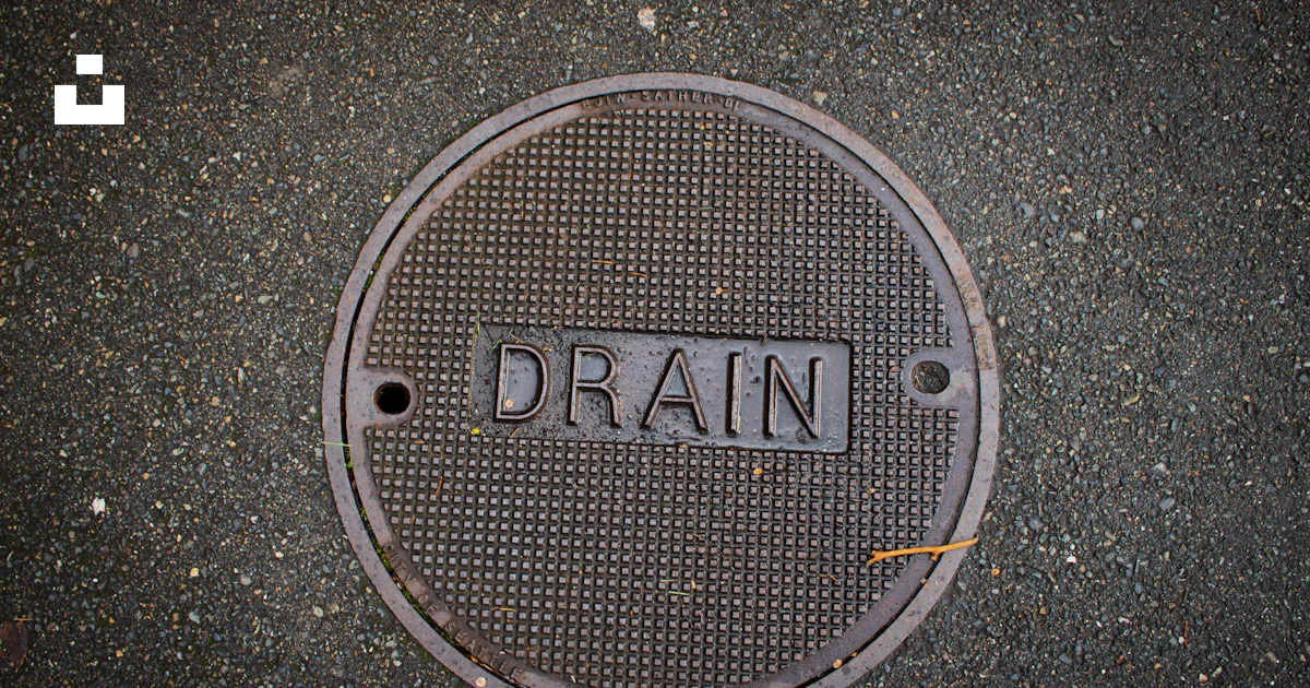Drain Lettering Drain cover with the word