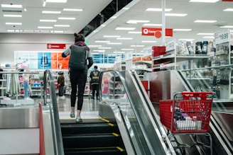 Person walks up the escalator in a target store.