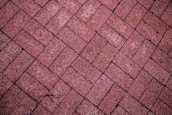 Brick patio in a herringbone pattern.