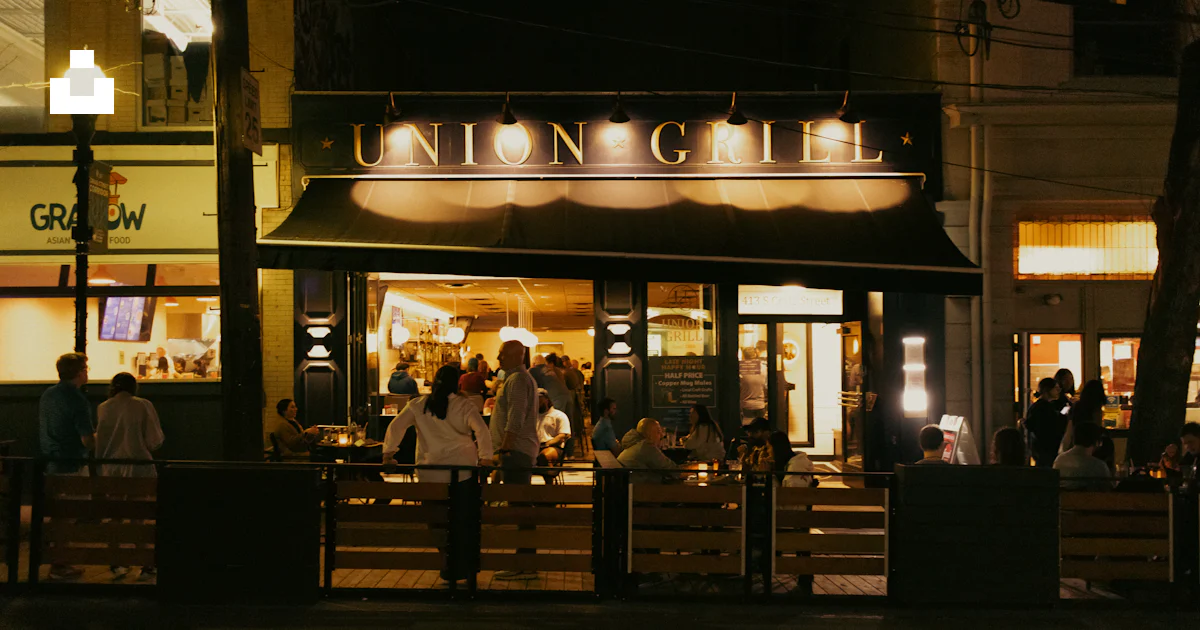 Union Grill Union grill restaurant illuminated at night. photo – Free City Image on ...