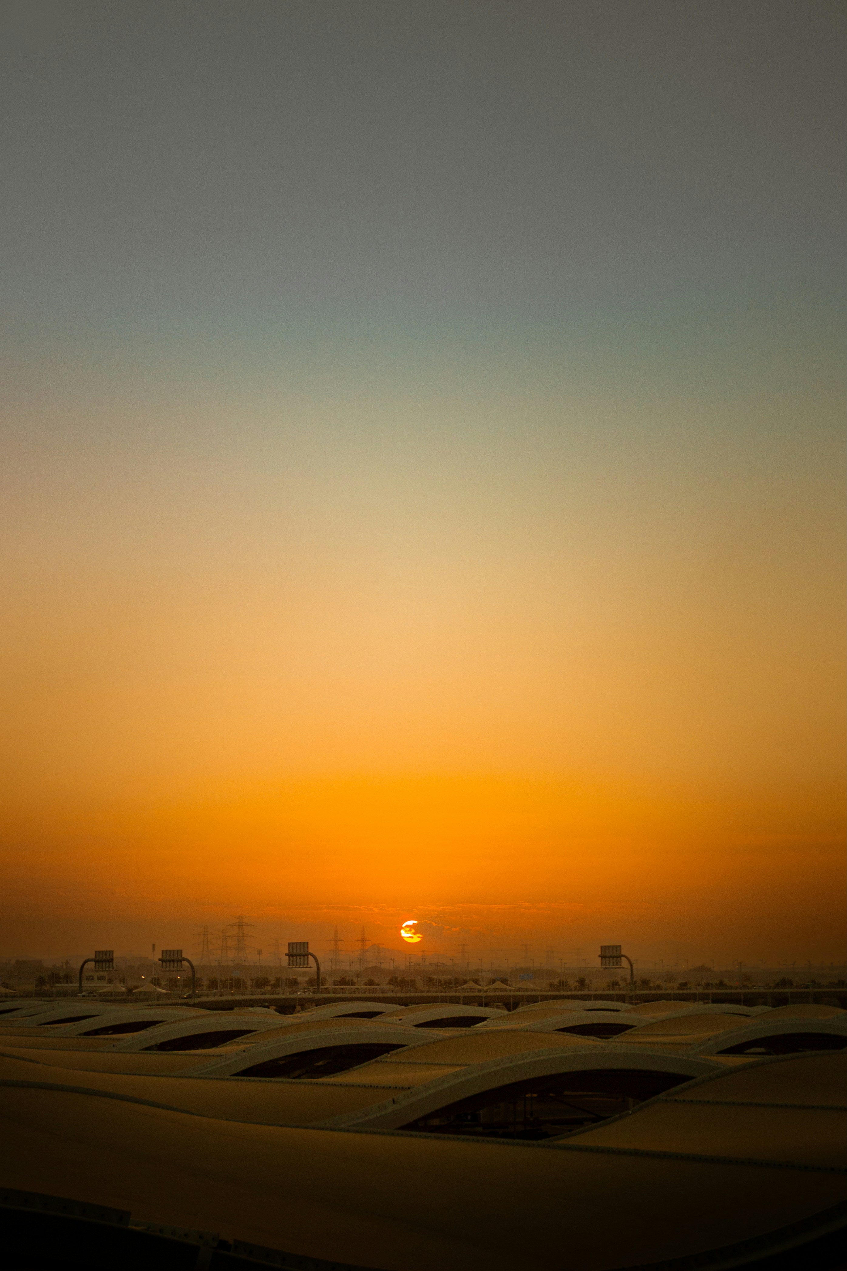 Sunrise over a modern rooftop landscape.