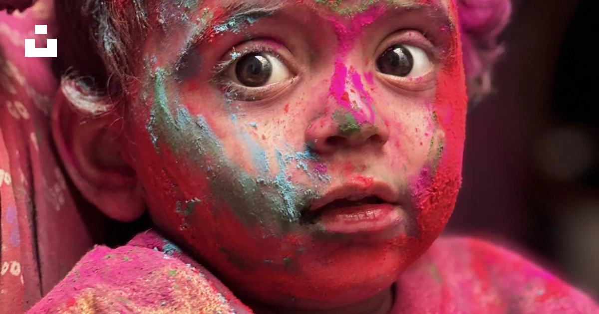 Child covered in colorful powder, enjoying holi. photo – Free Human ...