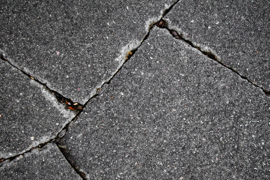 Severely cracked concrete pavement showing structural surface damage