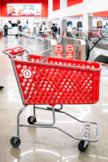A red target shopping cart sits in the store.