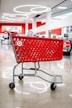 Red target shopping cart inside a store.