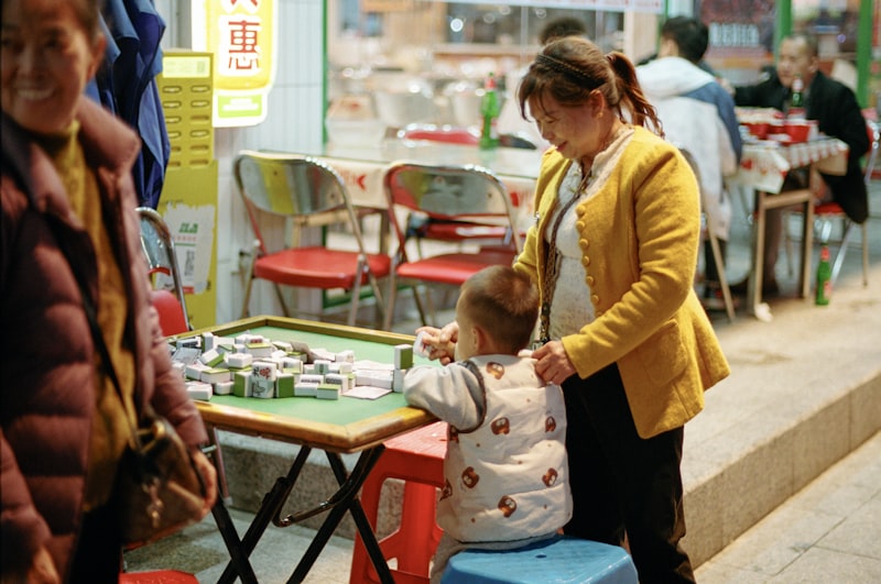 Teacher and child engaged in outdoor learning at daycare