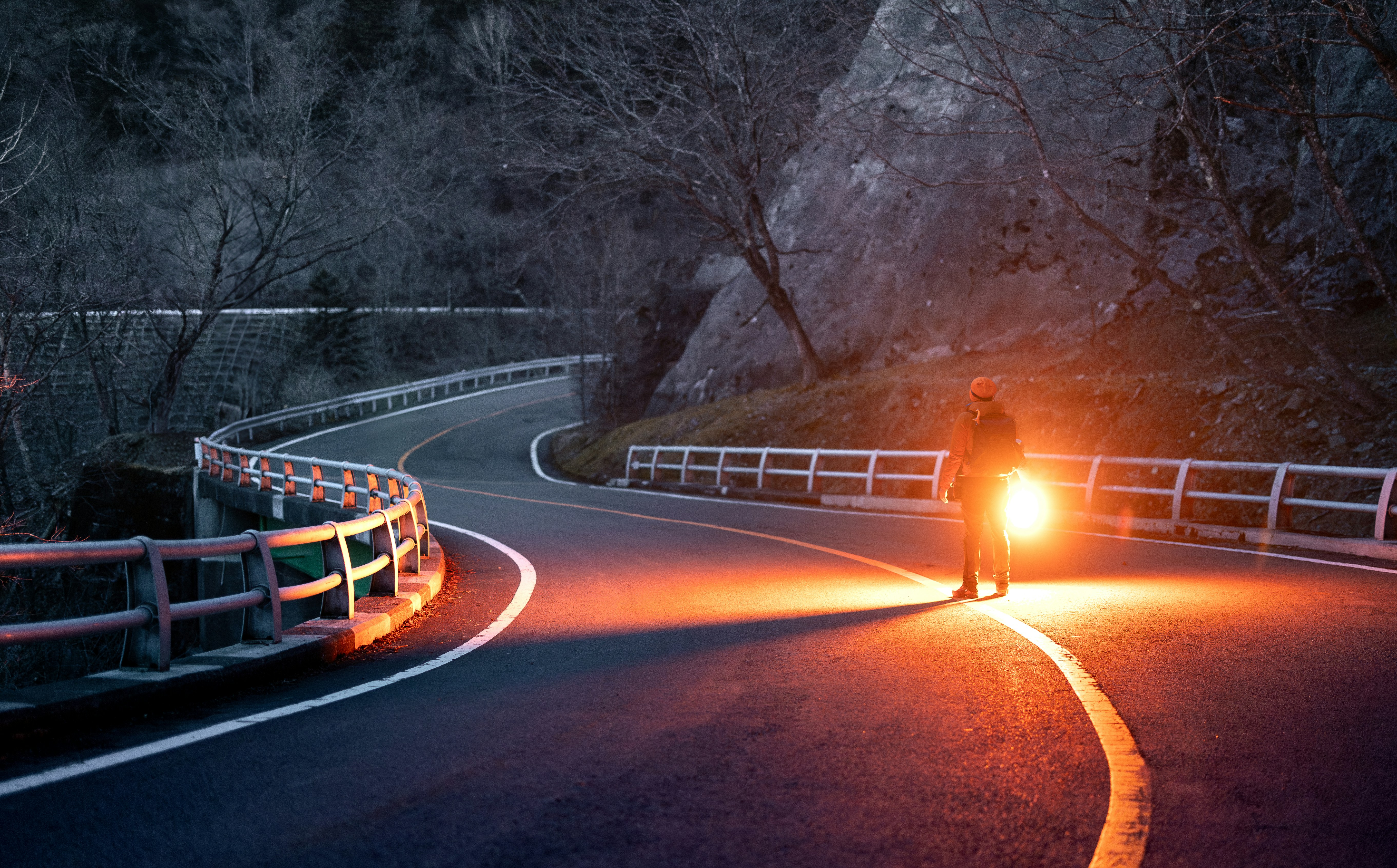 Fast luxury electric sedan driving quickly on an open highway