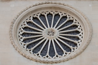 A decorative rose window in architectural design.