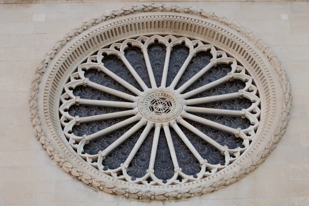 A decorative rose window in architectural design.