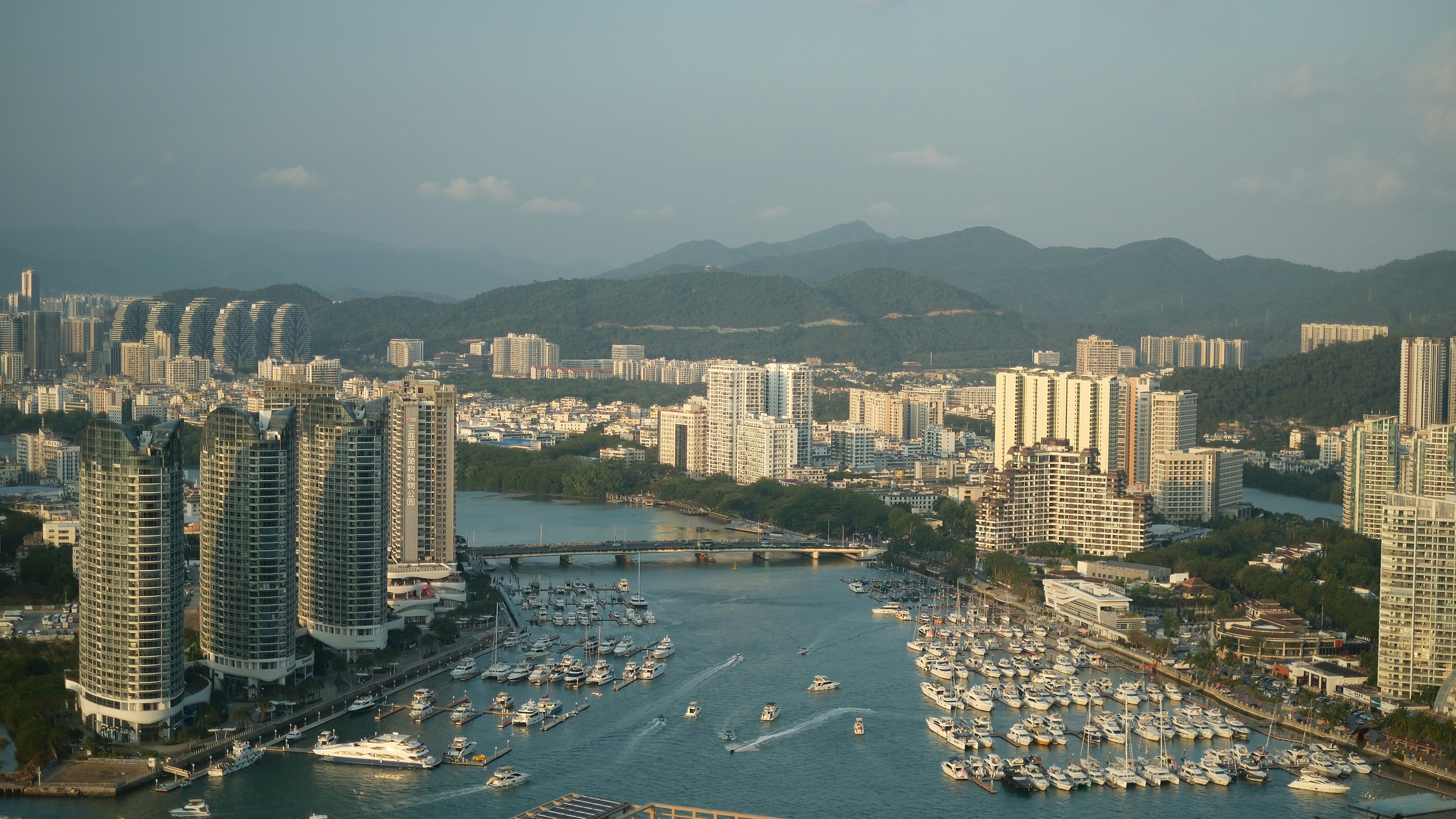 An urban harbor city view with boats.