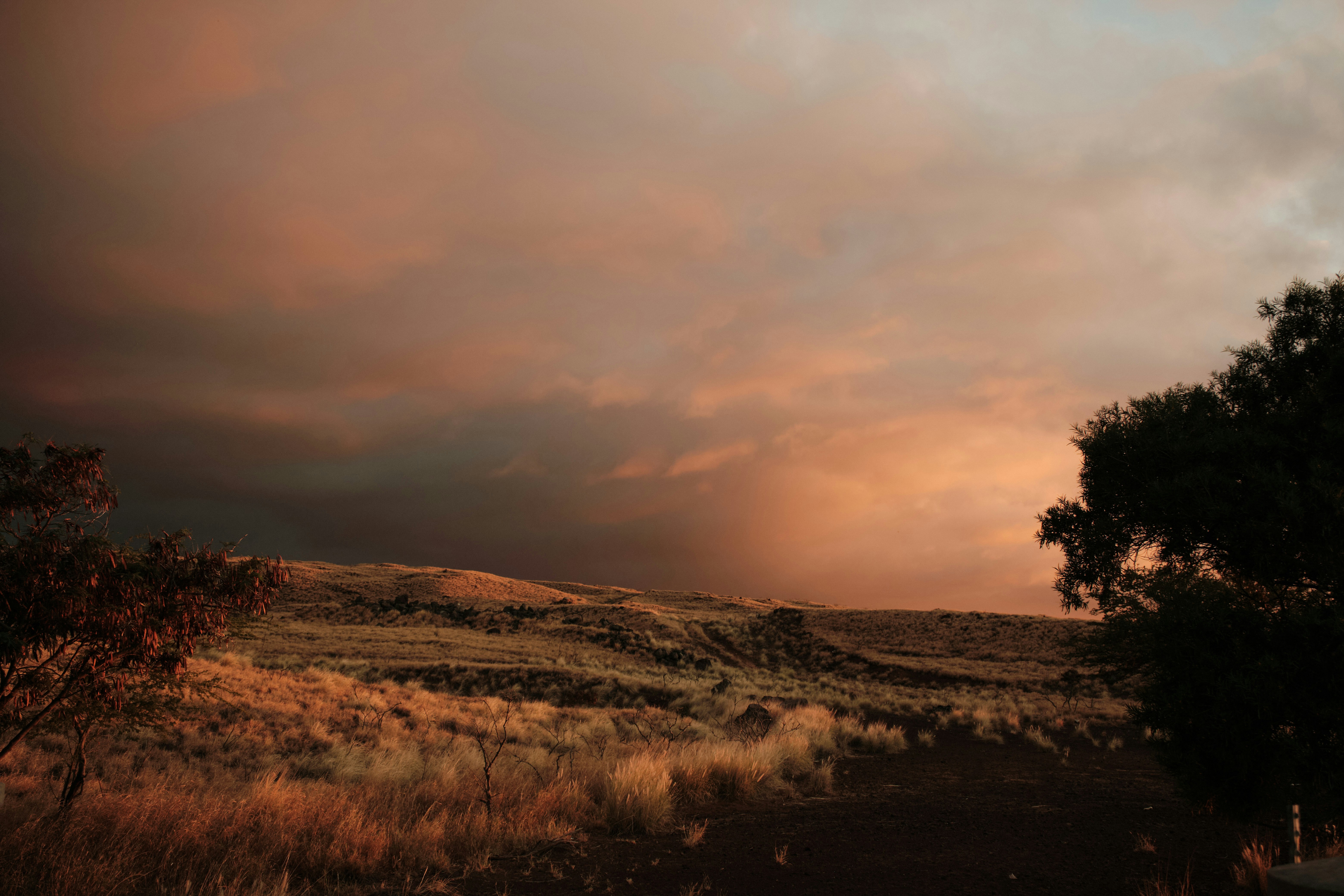 Dramatic sunset illuminates a vast, open landscape.