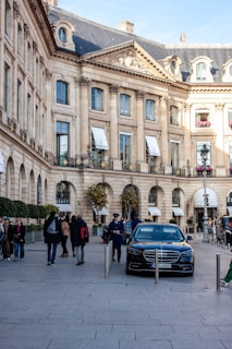 A luxury car parked in front of a building.