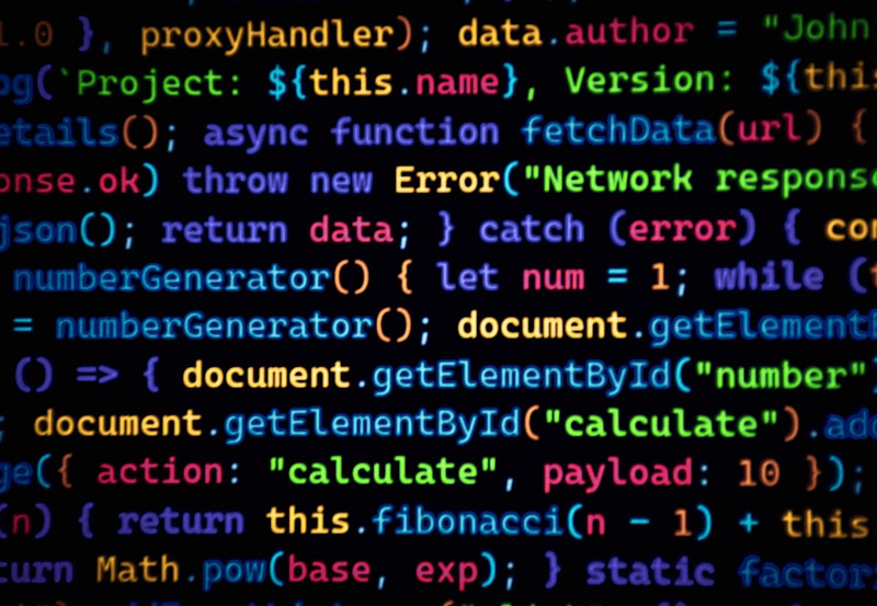 Colourful code scrolls across a dark background