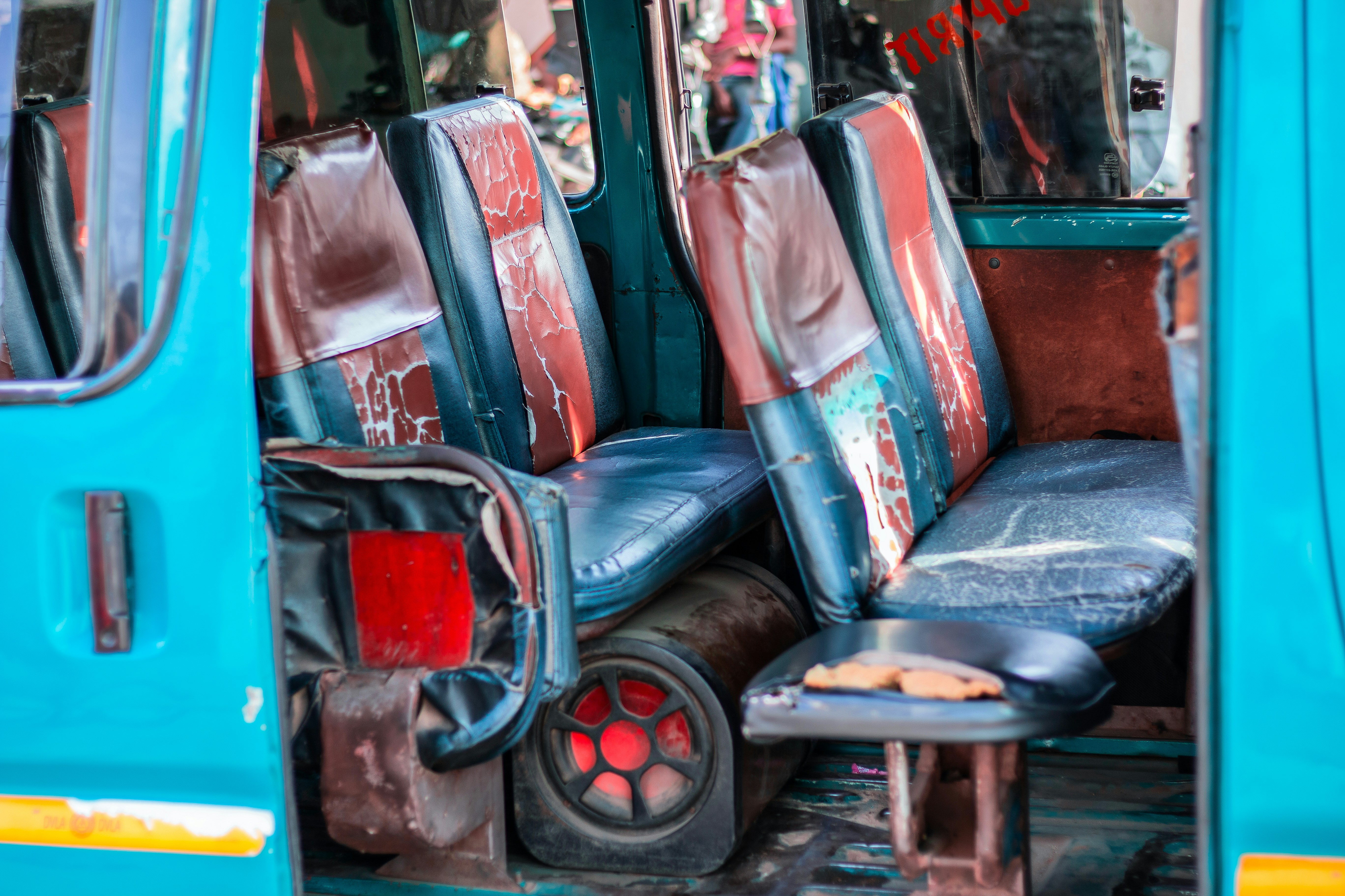Inside a well-worn, blue minibus.
