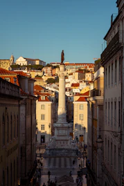 A monument stands tall in a european city.