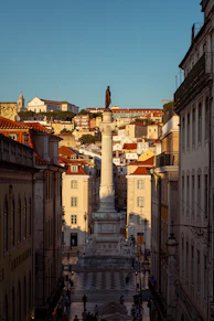 A monument stands tall in a european city.