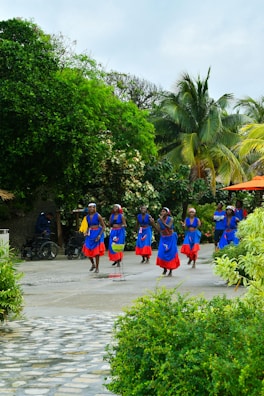 People dance in bright clothing.