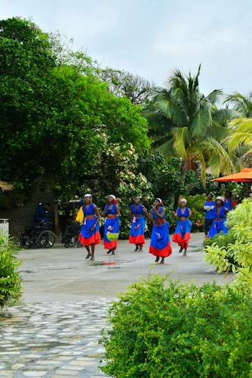 People dance in bright clothing.
