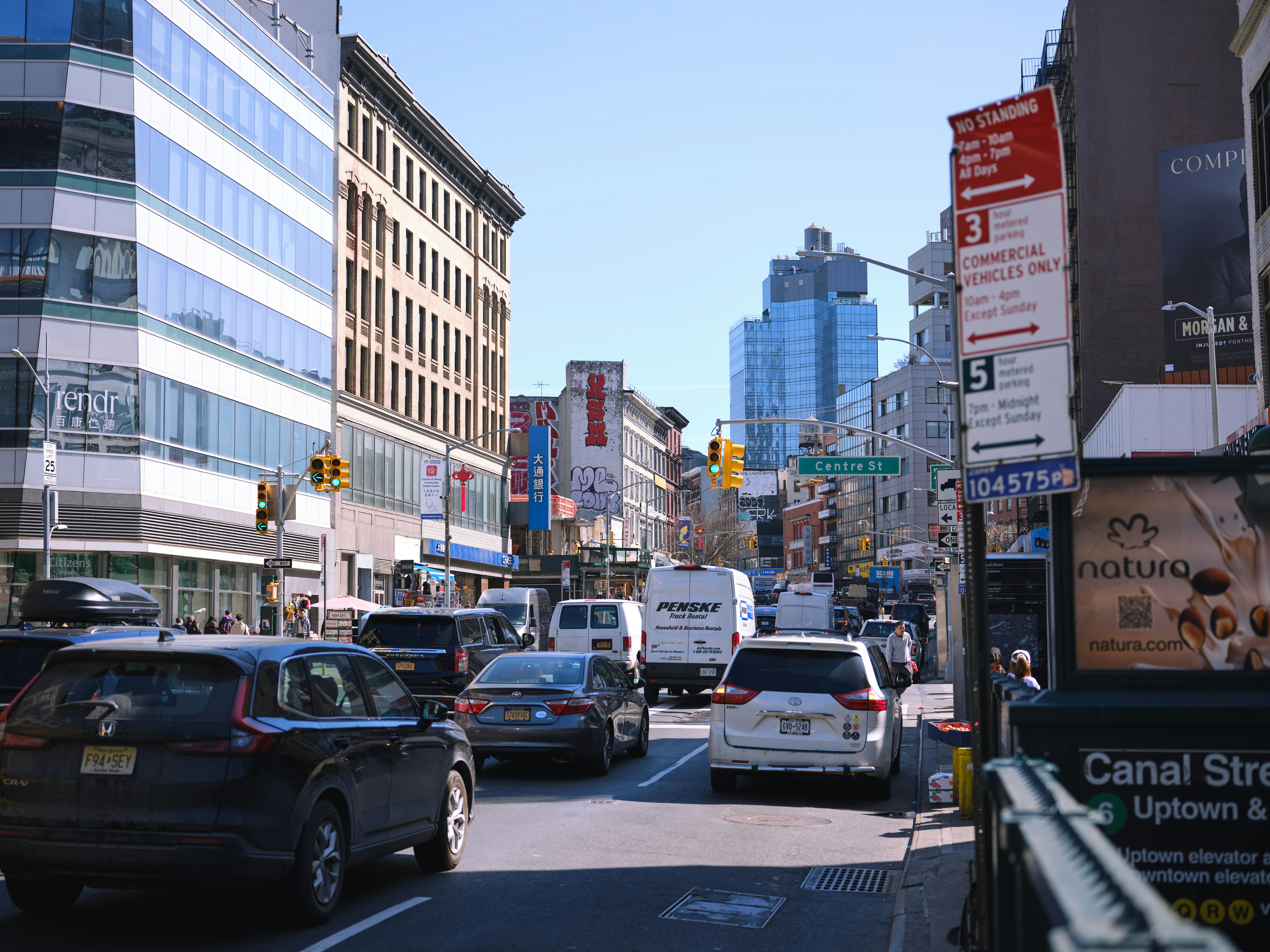 Busy city street with cars and buildings.