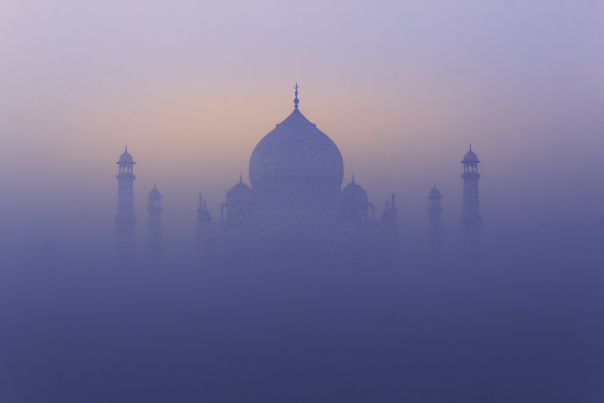 The taj mahal shrouded in beautiful morning mist.