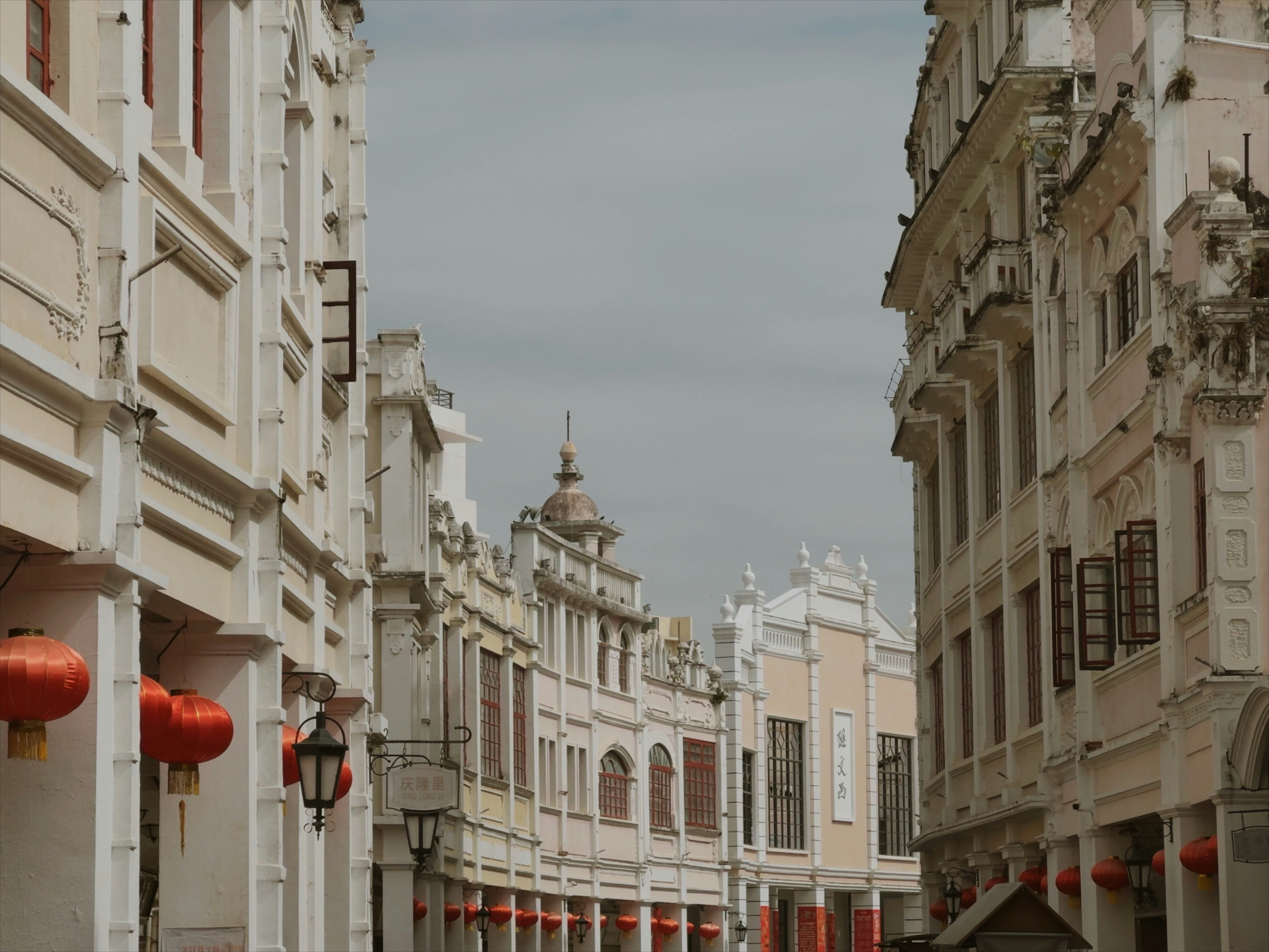 Historic buildings line a street with red lanterns. photo – Free ...