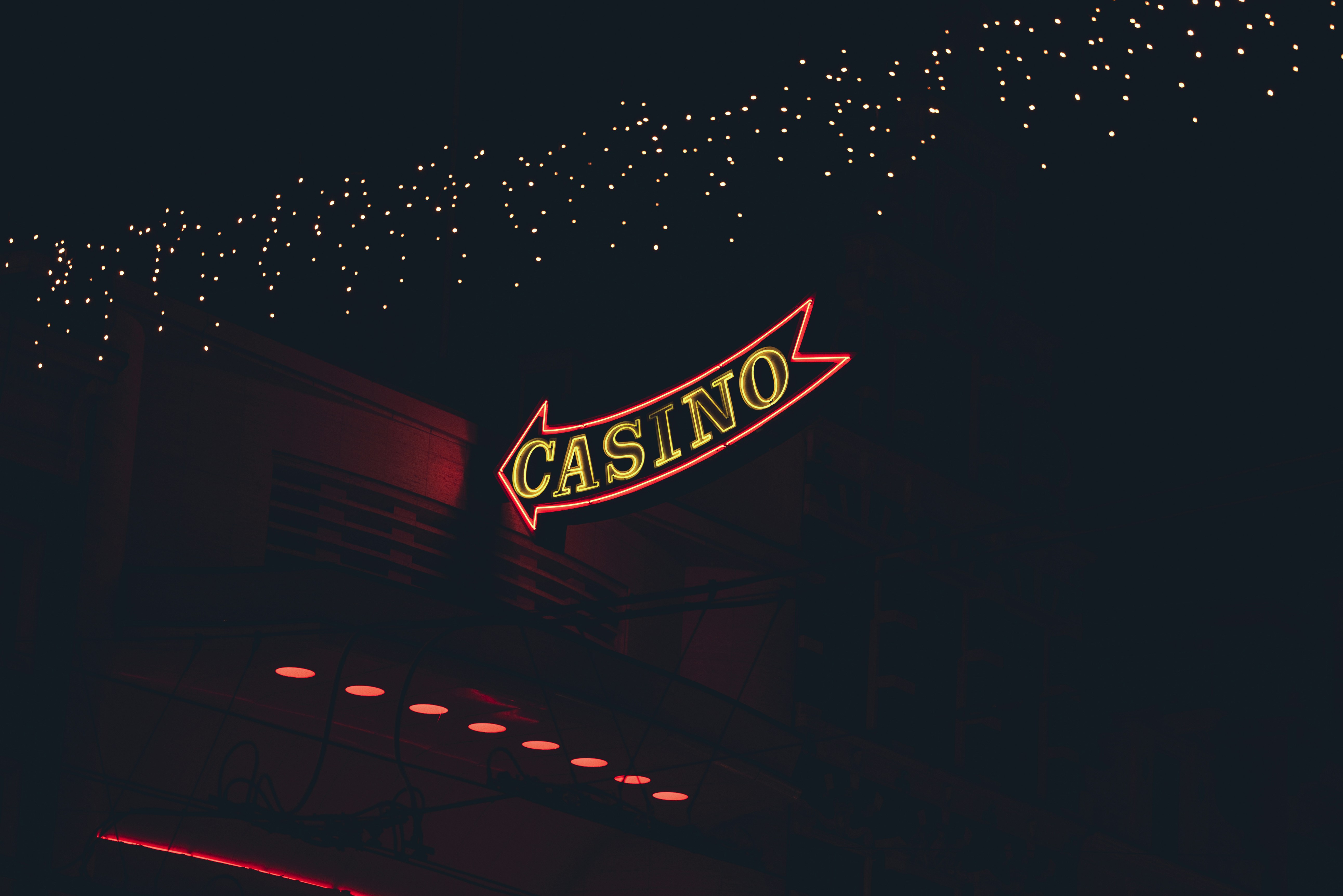 The casino sign glows brightly in the night.