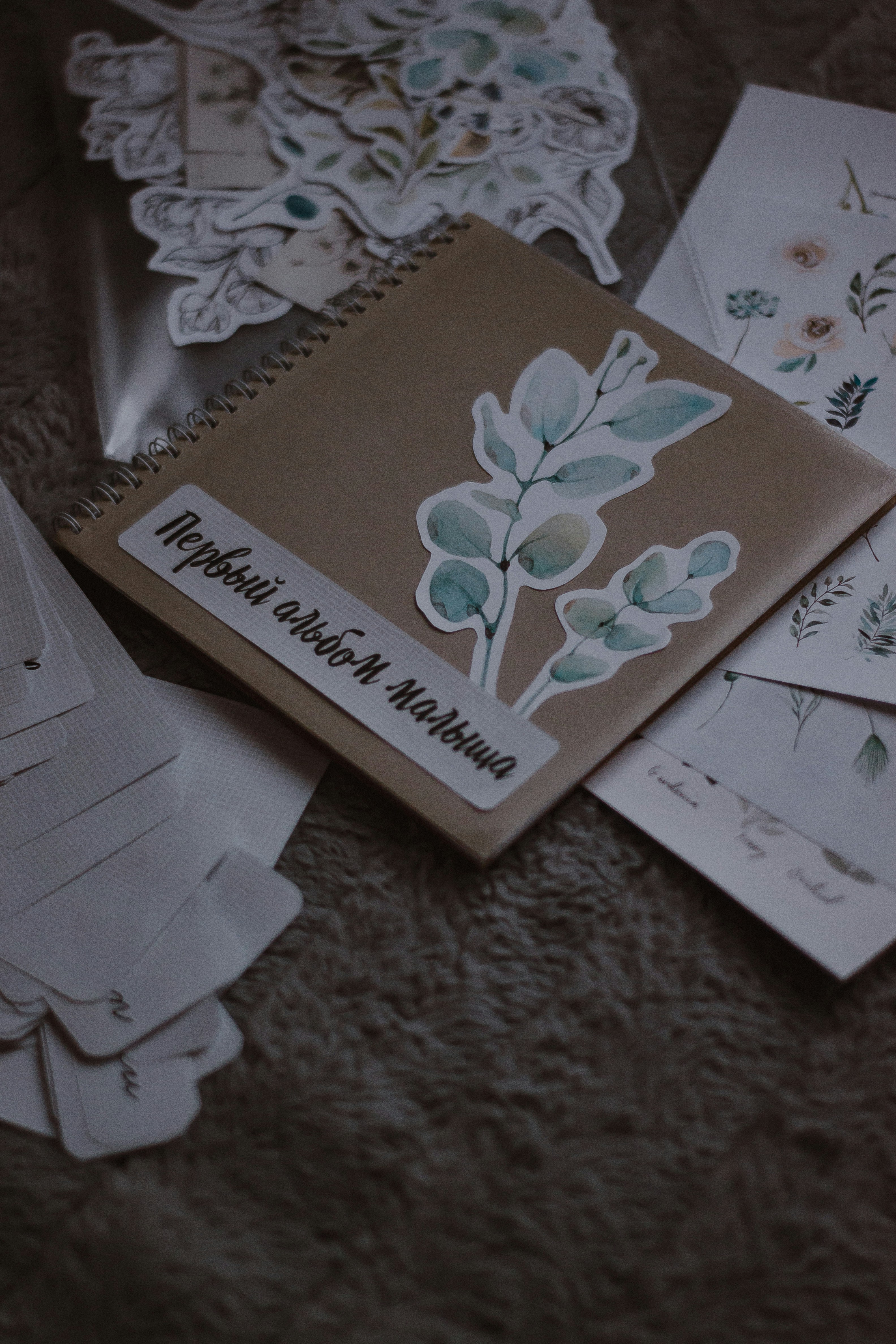 A scrapbook with floral designs and stickers.