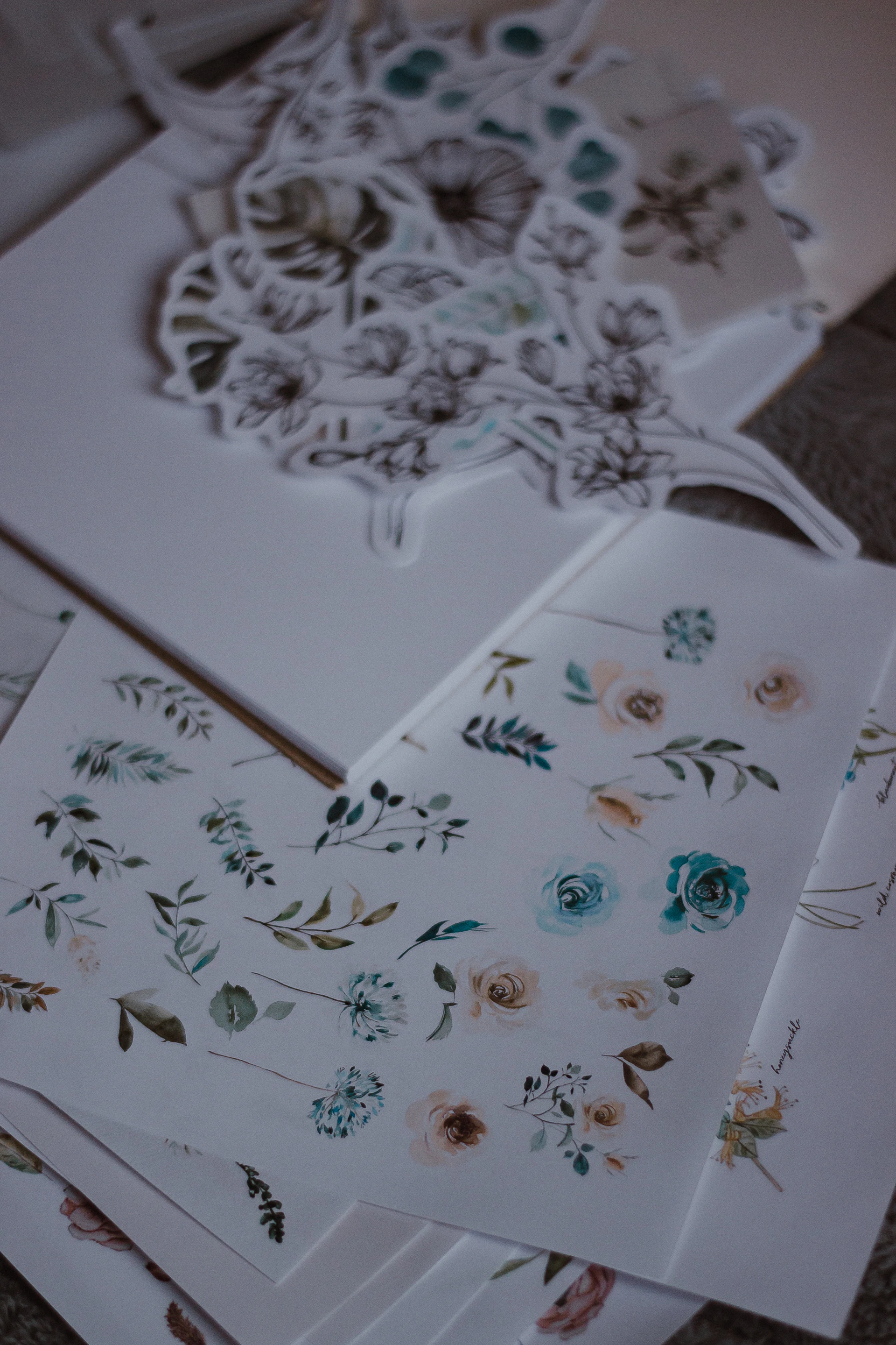 Floral stickers are displayed on a white surface.