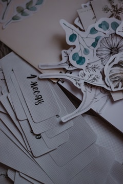 Botanical stickers and cards are shown.