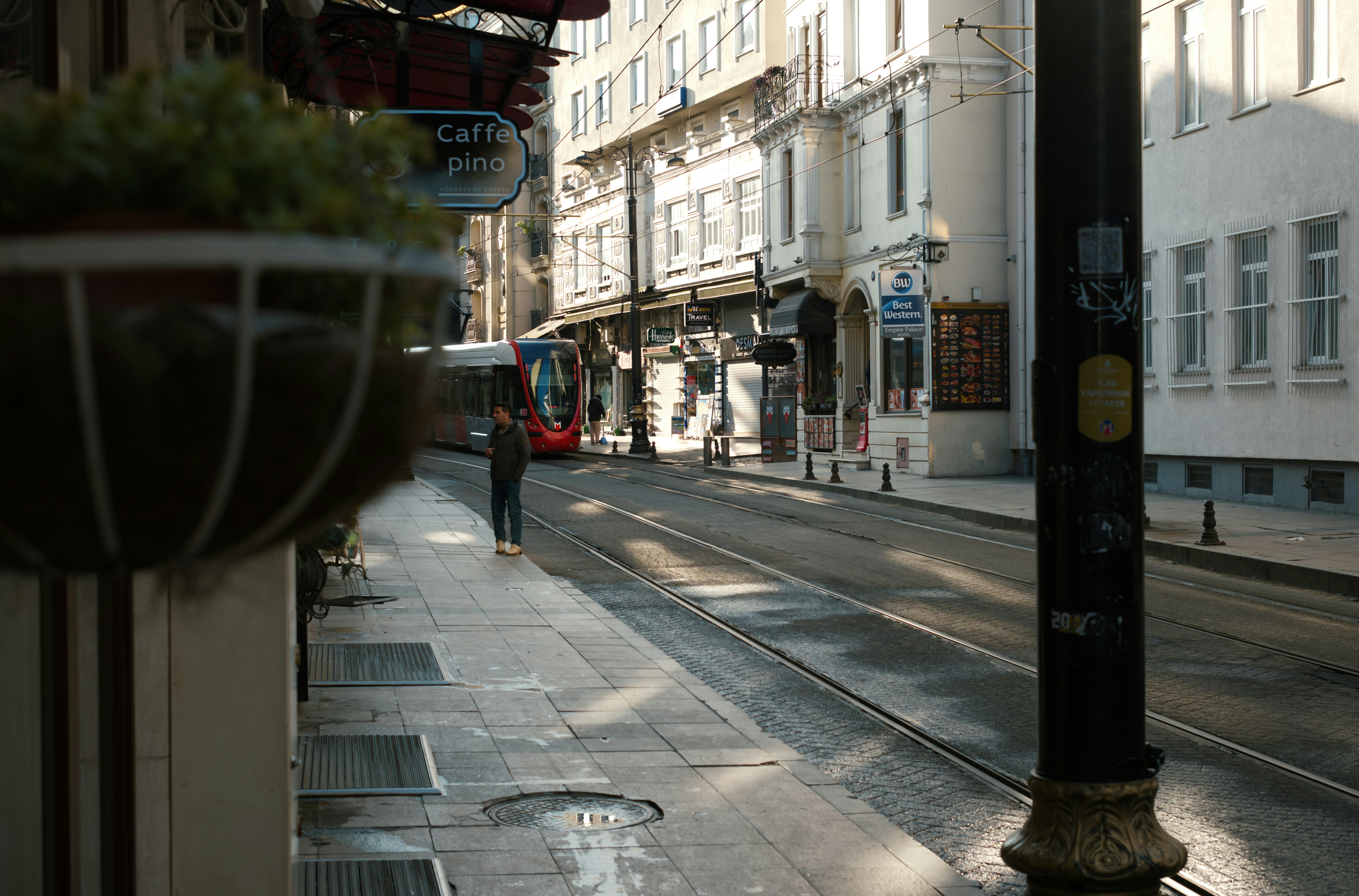 A person walks down a city street.